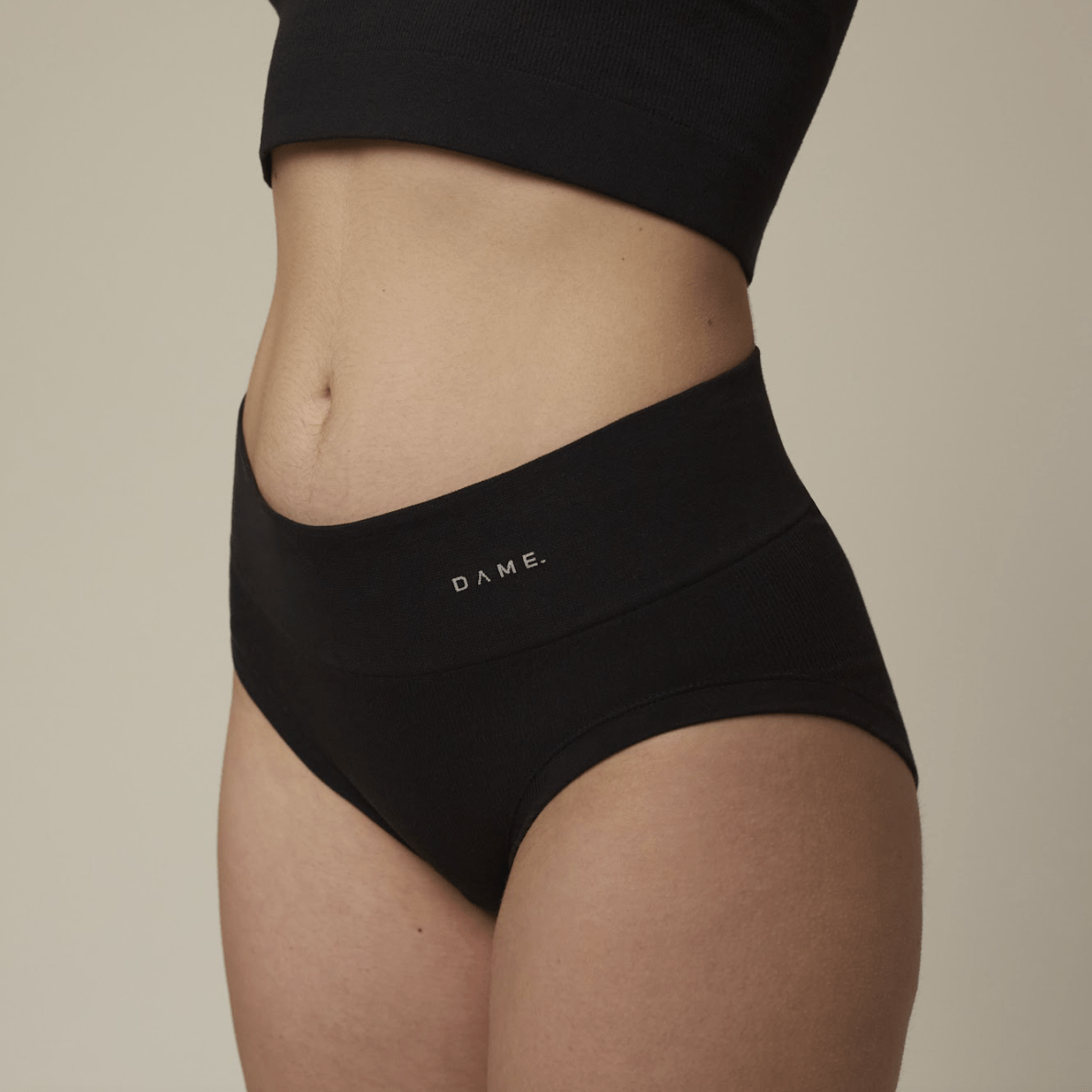 Seamless Period Pants by DAME in black featuring DAMEdry Tech, offering breathable, leak-proof, and eco-friendly menstrual protection for women.