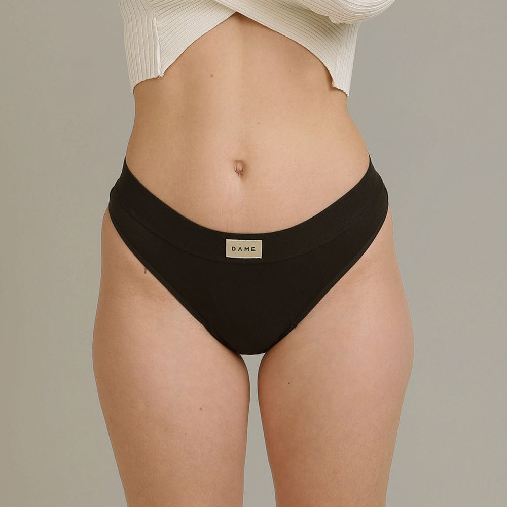 Thong Period Pant - Leak-Proof Underwear in black by DAME, featuring a soft cotton design for discreet period protection and lighter flow days.