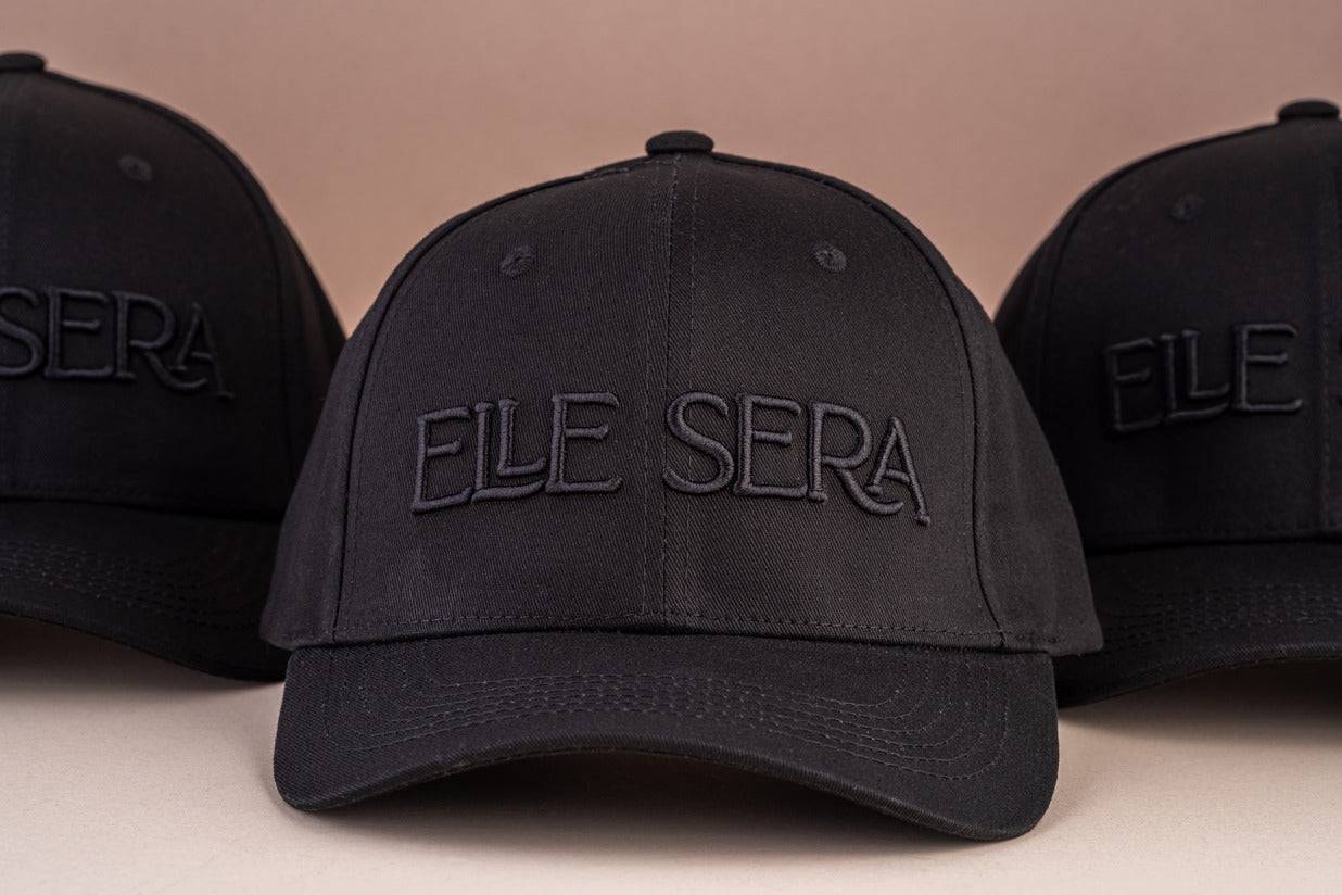 Elle Sera Cap in navy blue with bold white 3D logo embroidery, showcasing a snug fit and durable design. Stylish baseball cap for daily wear.