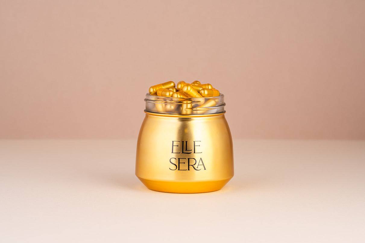 The Golden Pill Gift Set by Elle Sera featuring gold capsules in a jar, three supplement pouches, and a branded box. Energy supplement with no subscription.