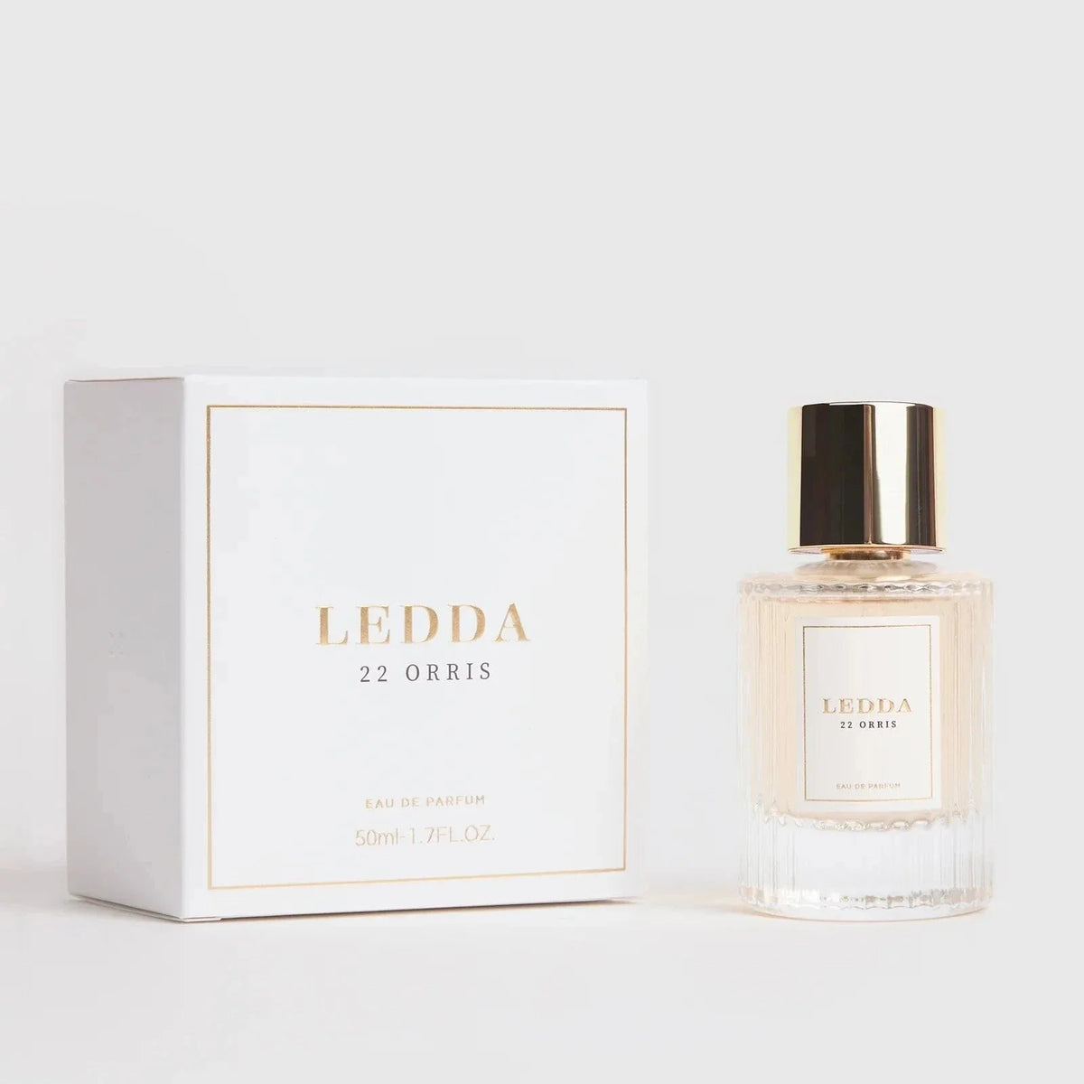 22 Orris Eau De Parfum 50ML by LEDDA with soft floral scent, featuring iris butter, jasmine, and musk in a clear ribbed glass bottle with gold cap.