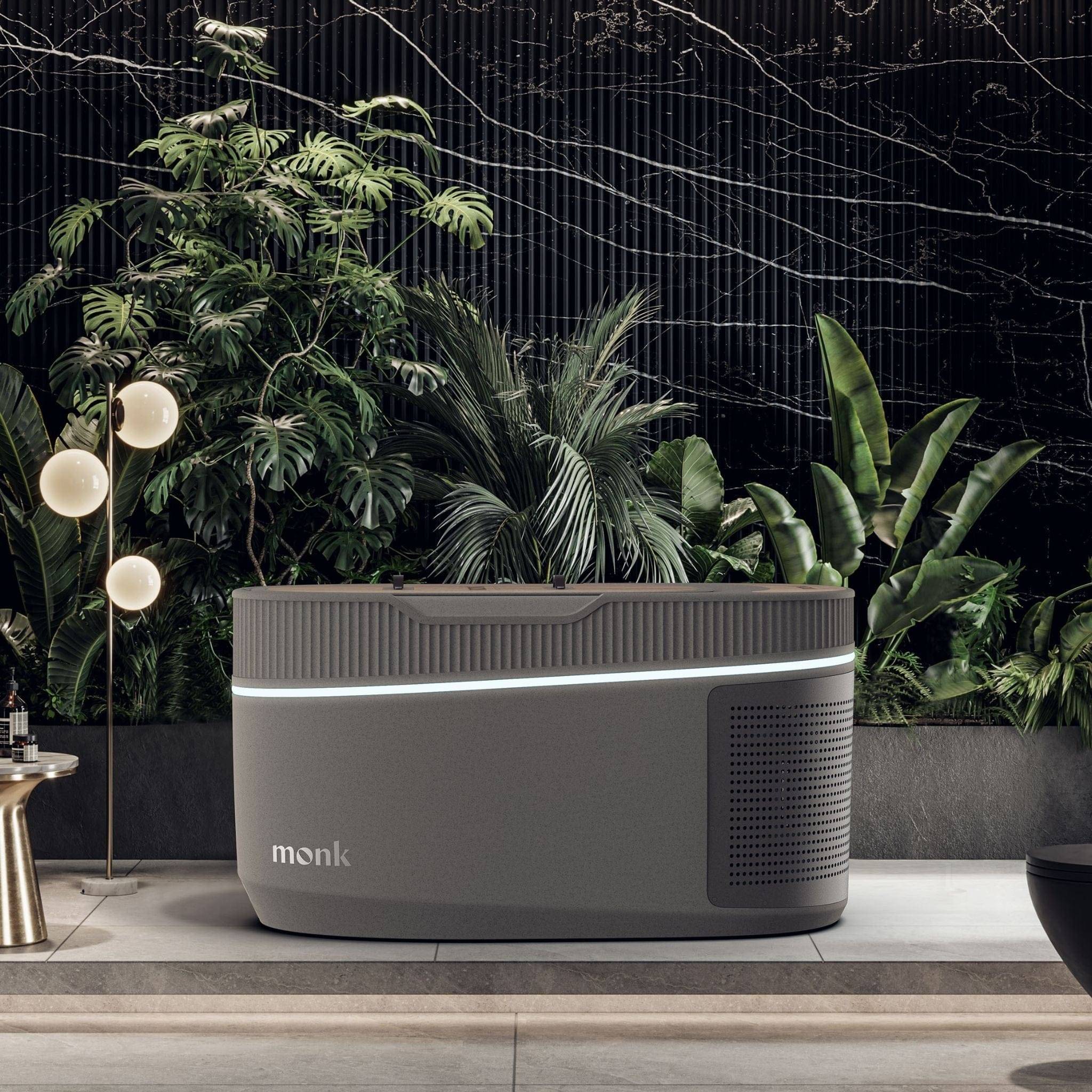 Monk Smart Ice Bath for optimal cold therapy with sleek gray design, self-cleaning system, and app connectivity, set in a luxury indoor spa space.