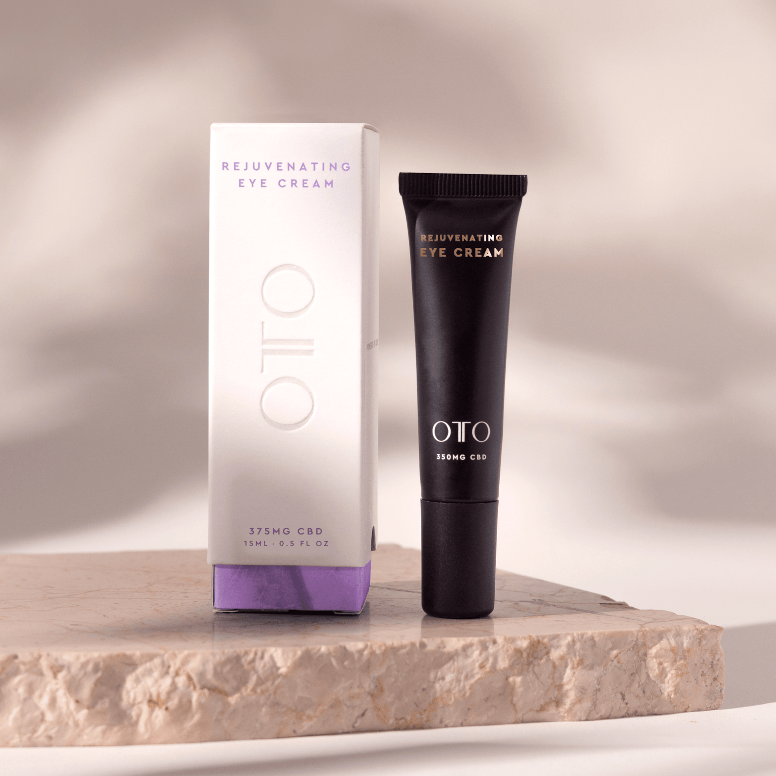 Rejuvenating Eye Cream - CBD Eye Cream for Dark Circles in sleek black tube with gold and white text, 350mg CBD by OTO for anti-aging skincare.