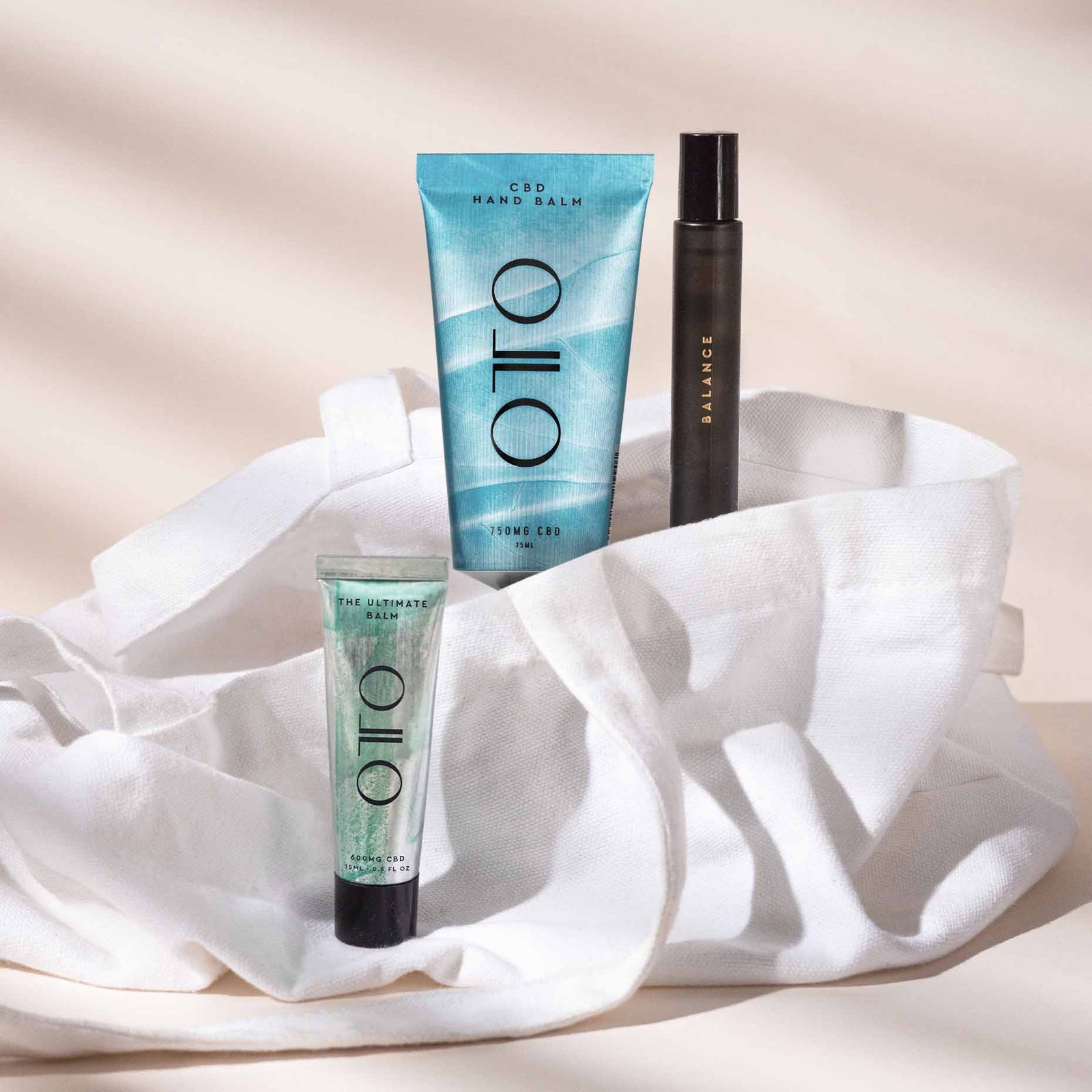Travel Collection - CBD Travel Essentials set featuring OTO CBD hand balm, roll-on oil, and ultimate balm for on-the-go skincare and wellness support.