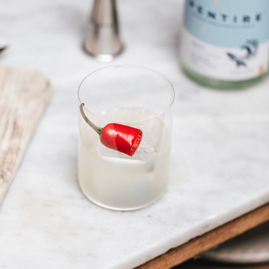 Pentire Adrift is a botanical non-alcoholic spirit distilled with rock samphire and citrus, capturing Cornwall's coastal essence for vibrant mocktails.