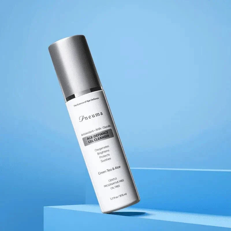 Age-Defiance Gel Cleanser by Pneuma with green tea and aloe in sleek silver pump bottle. Anti-aging botanical formula for gentle daily facial cleansing.