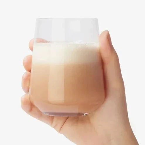 Totally Derma® 90 Days - Collagen for Radiant Skin supplement with a glass of mixed drink, ideal for skin hydration and joint health support.