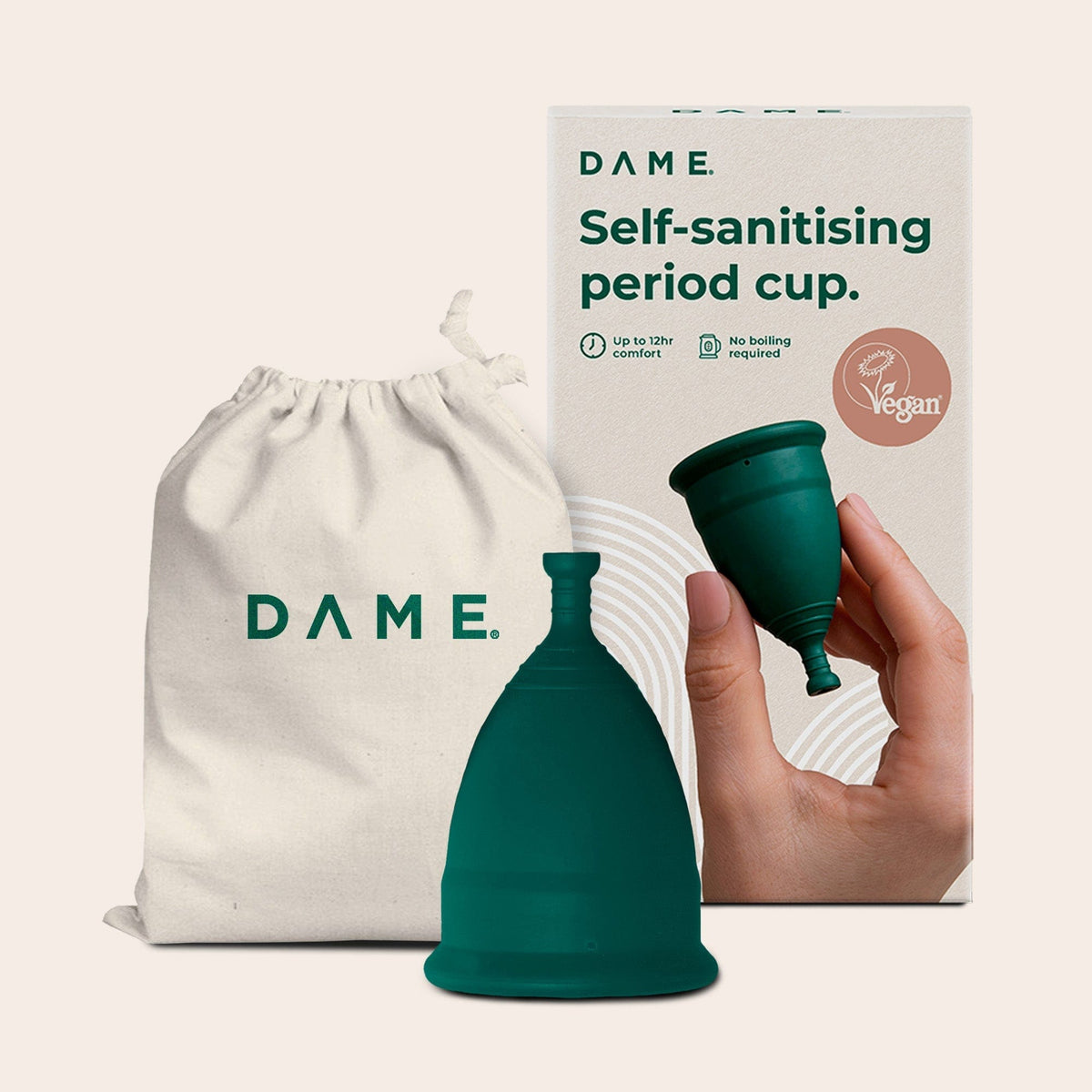 DAME Period Cup® in packaging held by hand, highlighting self-sanitising, vegan, and 12-hour comfort features. Eco-friendly menstrual cup for sustainable care.