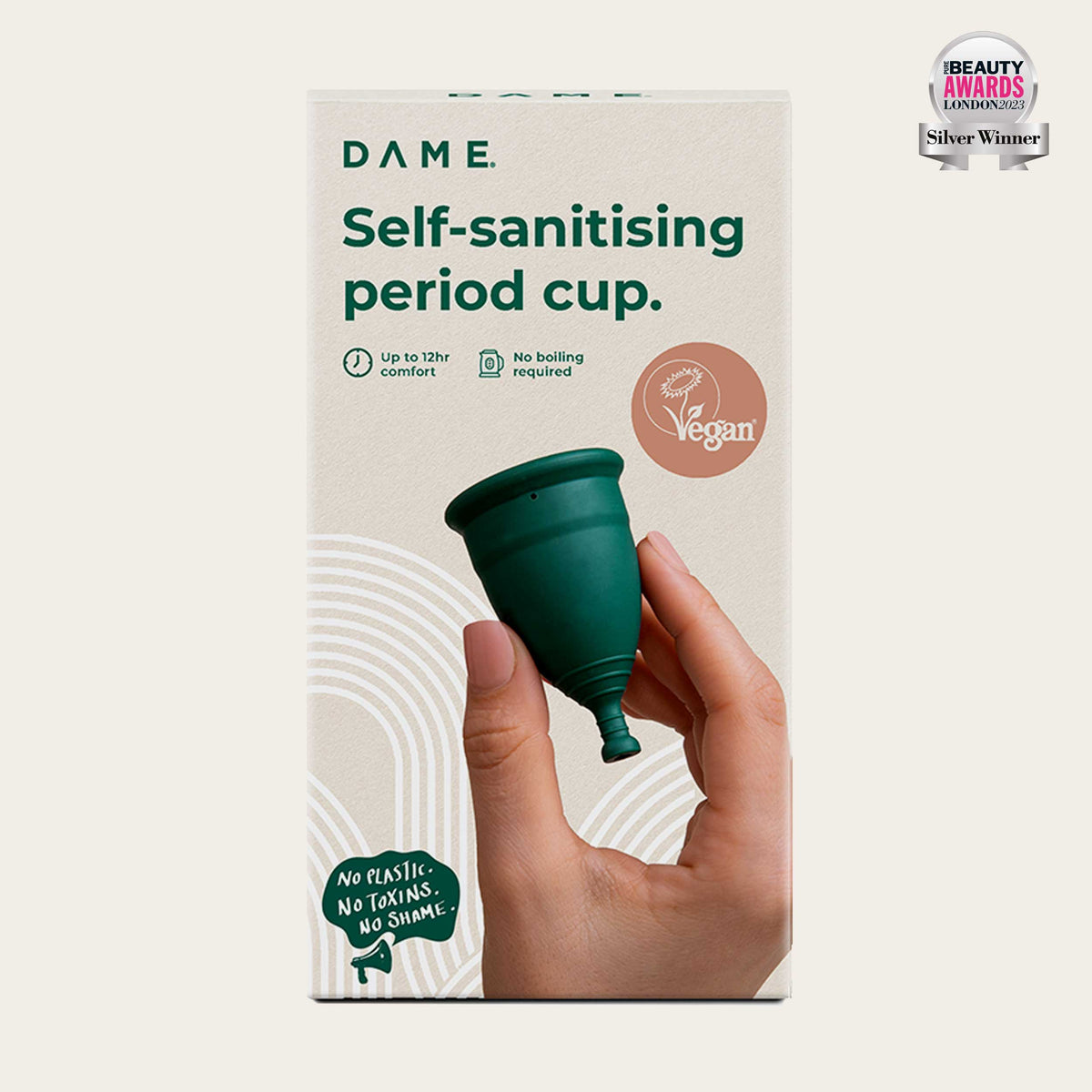 DAME Period Cup® in packaging held by hand, highlighting self-sanitising, vegan, and 12-hour comfort features. Eco-friendly menstrual cup for sustainable care.