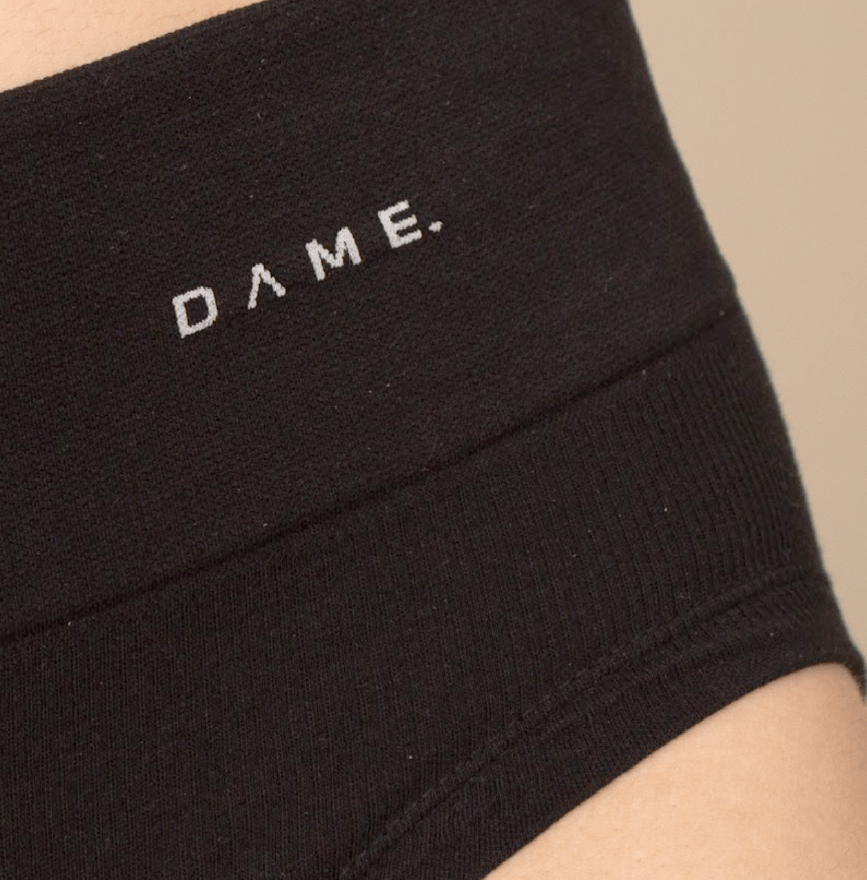 Seamless Period Pants by DAME in black featuring DAMEdry Tech, offering breathable, leak-proof, and eco-friendly menstrual protection for women.