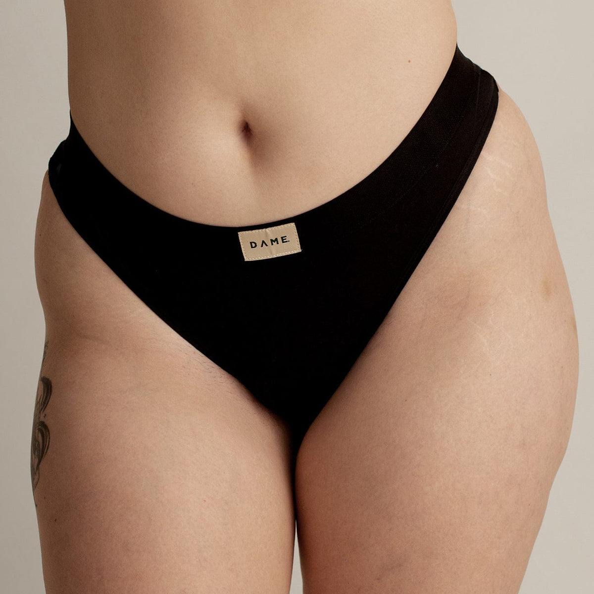 Thong Period Pant - Leak-Proof Underwear in black by DAME, featuring a soft cotton design for discreet period protection and lighter flow days.