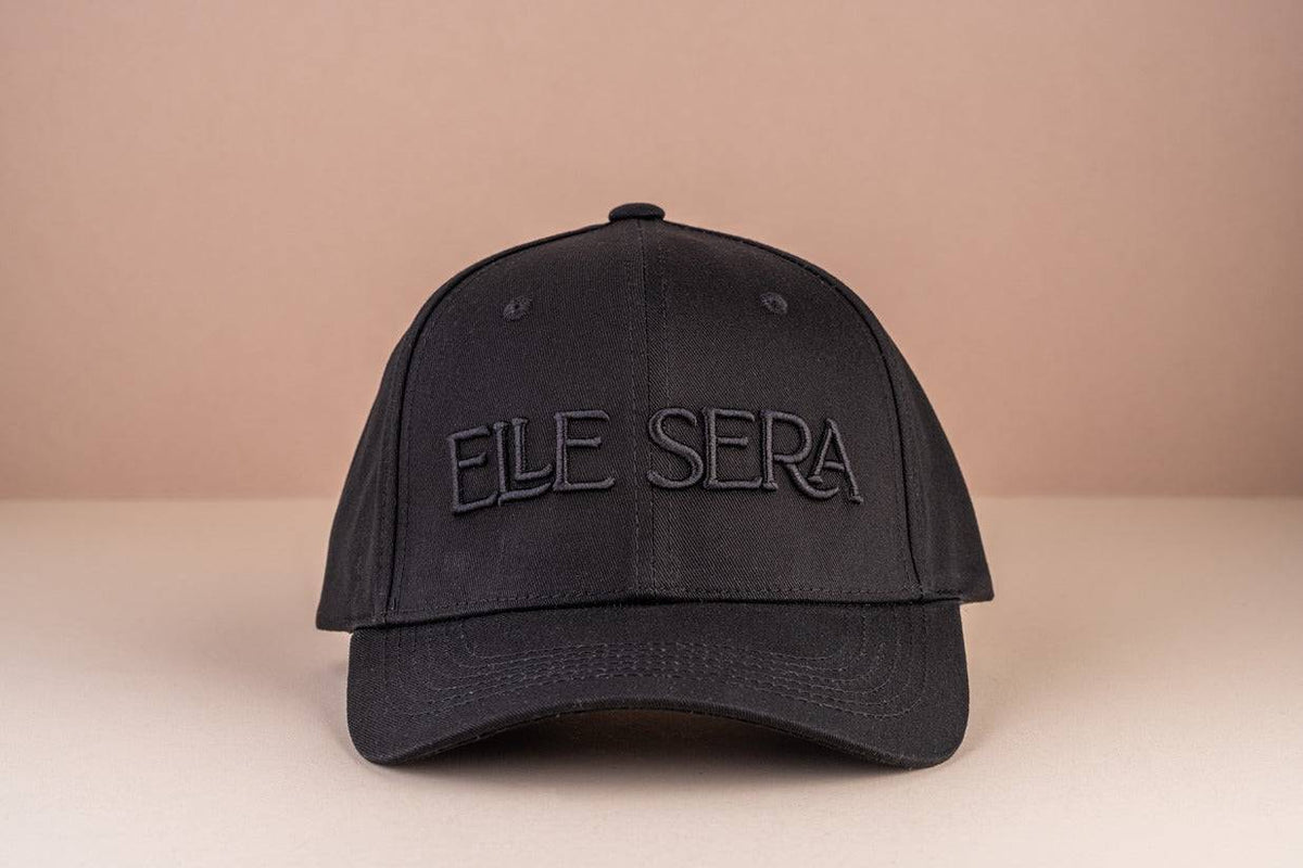Elle Sera Cap in navy blue with bold white 3D logo embroidery, showcasing a snug fit and durable design. Stylish baseball cap for daily wear.