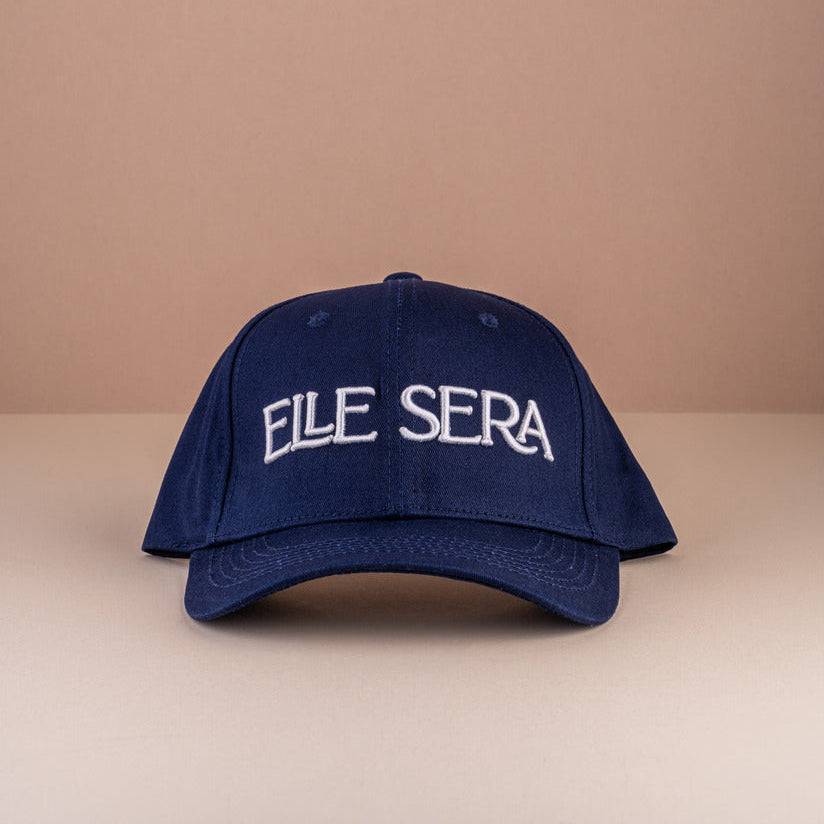 Elle Sera Cap in navy blue with bold white 3D logo embroidery, showcasing a snug fit and durable design. Stylish baseball cap for daily wear.