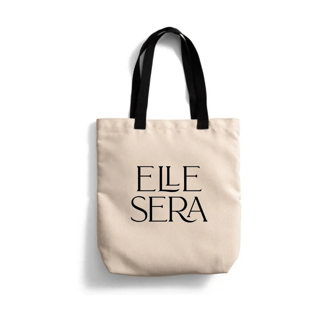 Eco Canvas Tote Bag by Elle Sera in beige with black handles. Sustainable and durable design ideal for everyday use and eco-conscious shoppers.