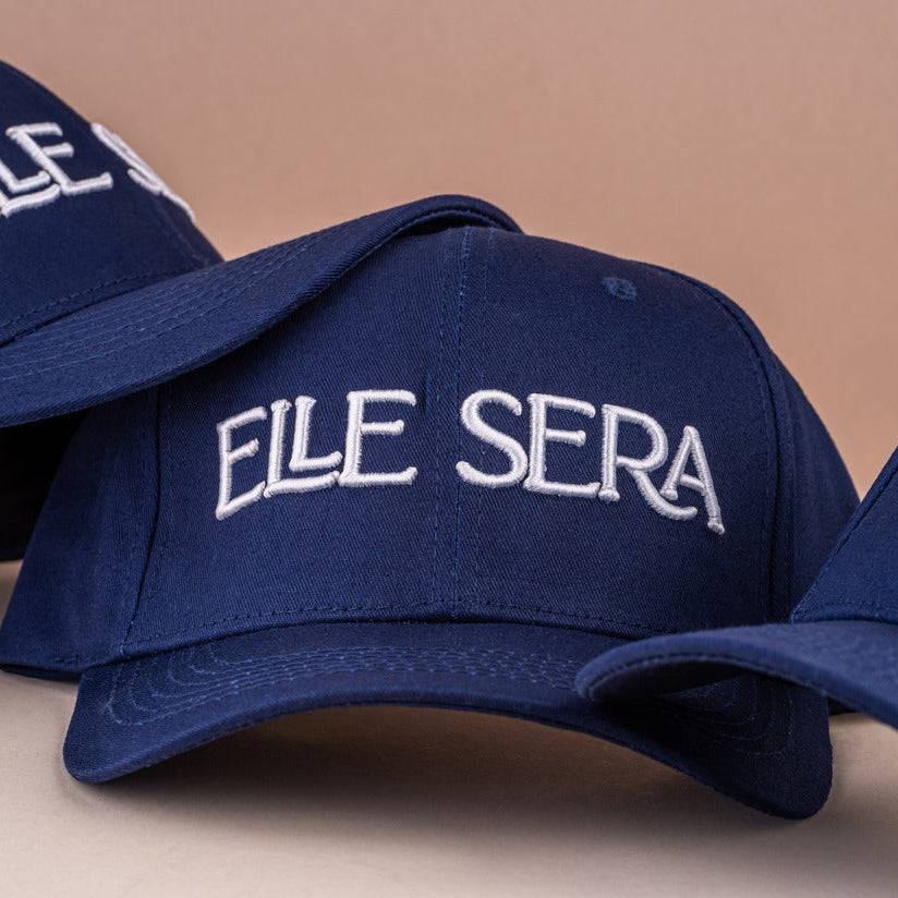 Elle Sera Cap in navy blue with bold white 3D logo embroidery, showcasing a snug fit and durable design. Stylish baseball cap for daily wear.