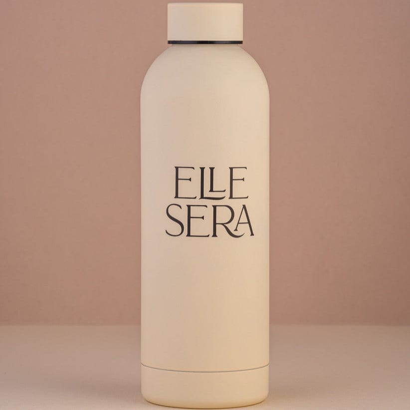 Elle Sera Water Bottle - Stainless Steel | High-Grade Metal in matte beige finish, featuring minimalist branding. Ideal for stylish hydration needs.