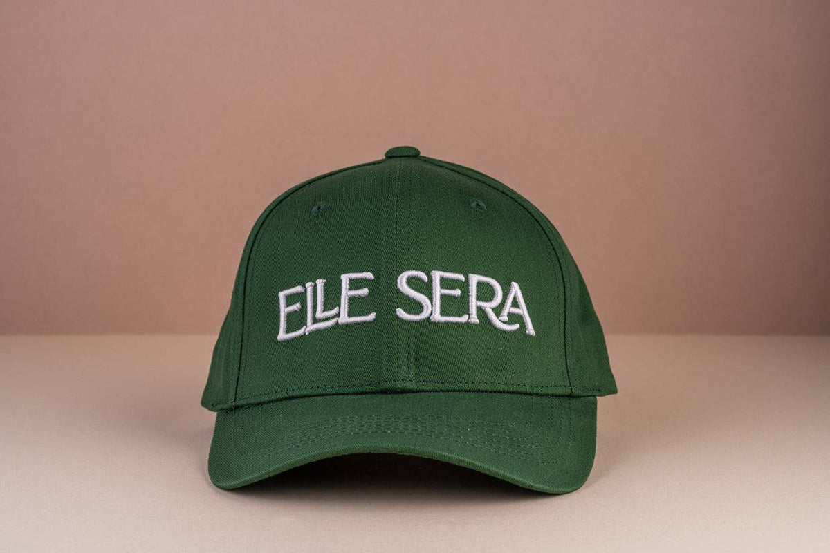 Elle Sera Cap in navy blue with bold white 3D logo embroidery, showcasing a snug fit and durable design. Stylish baseball cap for daily wear.