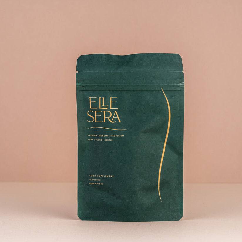 Elle Sera Magnesium Liposomal Bisglycinate Supplement in dark green resealable pouch with green capsules, ideal for stress relief and muscle support.