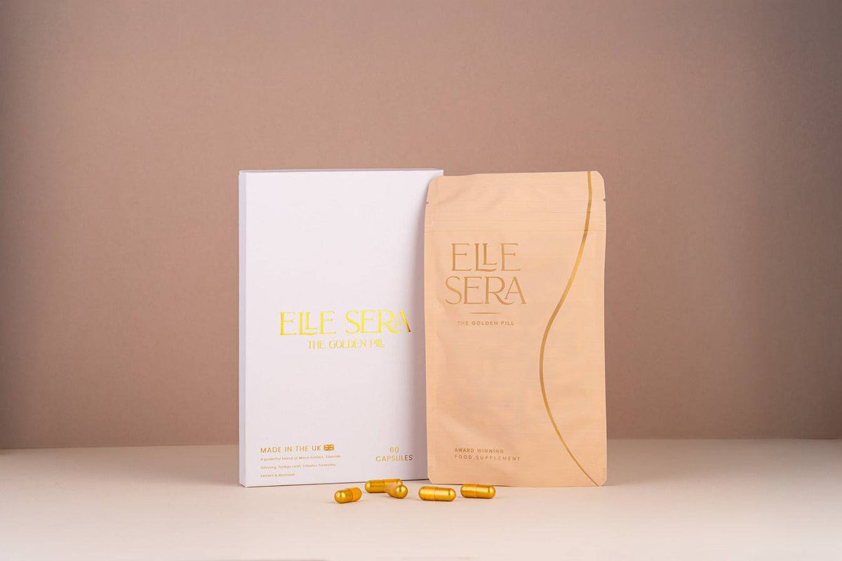 The Golden Pill Gift Set by Elle Sera featuring gold capsules in a jar, three supplement pouches, and a branded box. Energy supplement with no subscription.