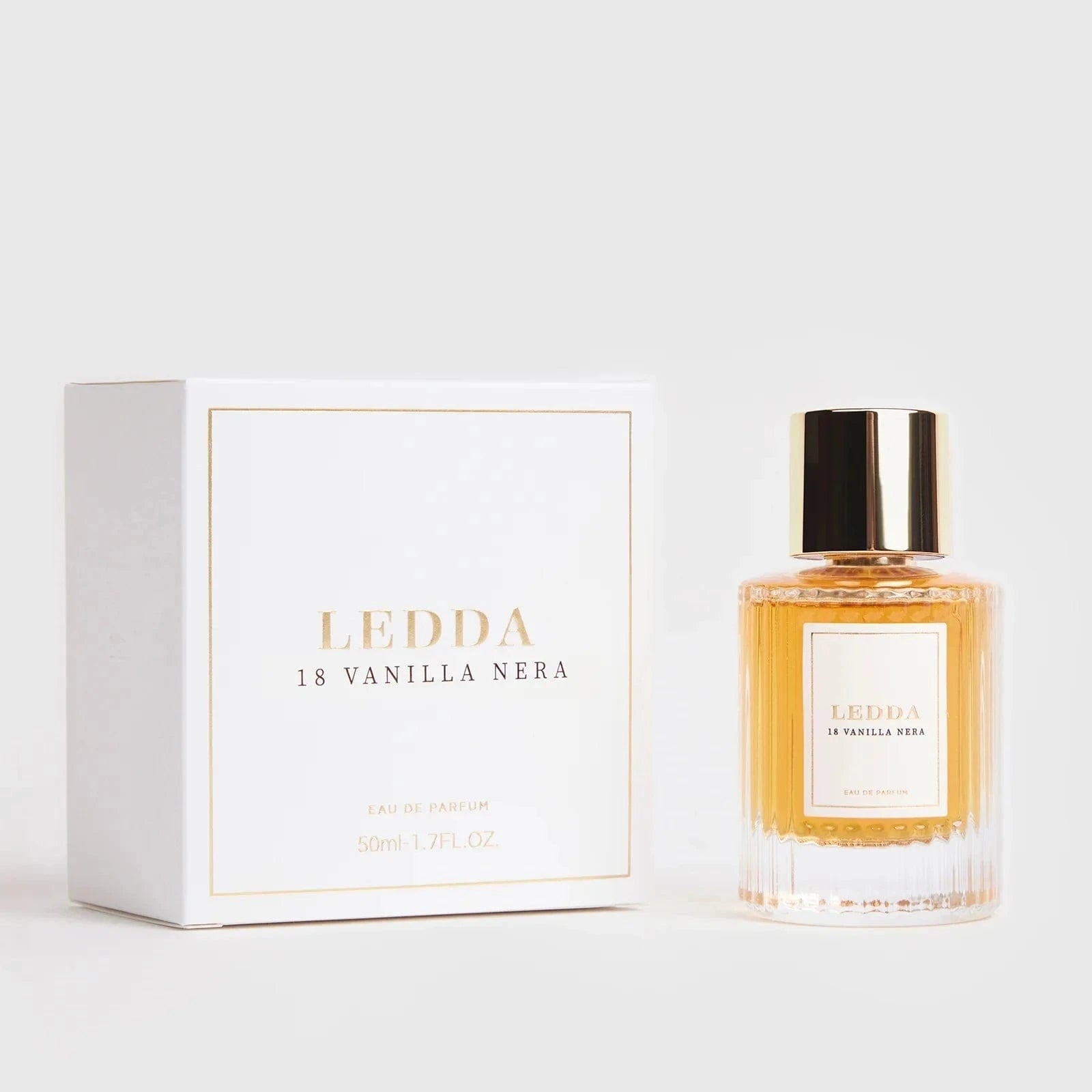 18 Vanilla Nera Eau De Parfum - 50 ML by LEDDA in a clear ribbed glass bottle with gold cap, offering a sweet smoky fragrance blend.