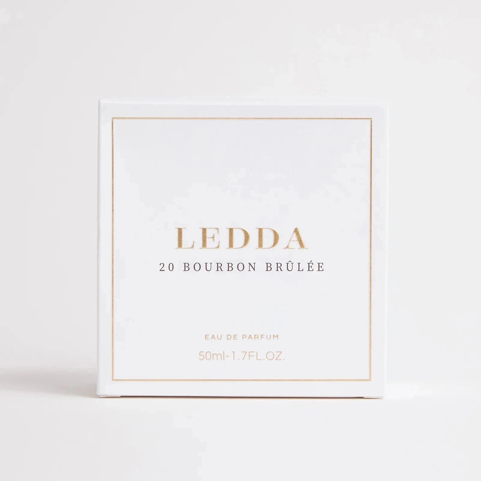 Bourbon Brûlée Eau De Parfum 50ml by Ledda in a clear ribbed glass bottle with gold cap, ideal for warm and indulgent fall scents.