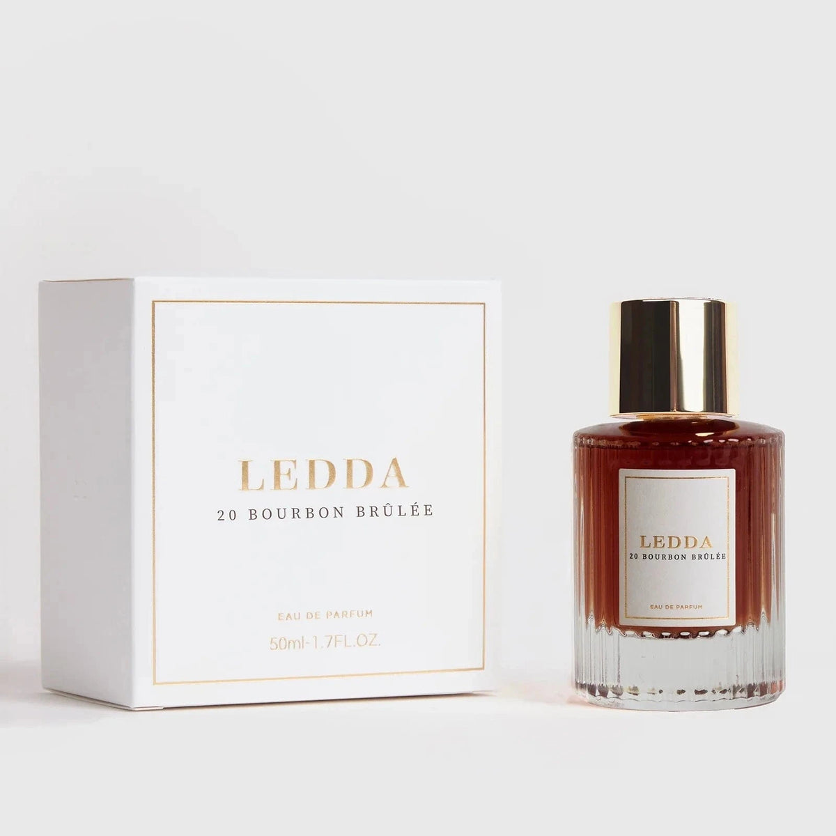 Bourbon Brûlée Eau De Parfum 50ml by Ledda in a clear ribbed glass bottle with gold cap, ideal for warm and indulgent fall scents.