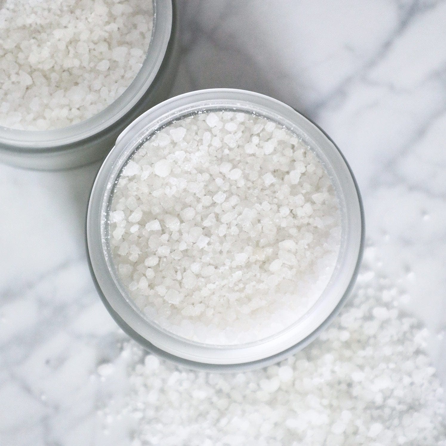 Restorative Bath Salts - 200g, a silken mineral soak with Dead Sea salts and avocado oil, supports skin repair and relaxation for a pure bath experience.