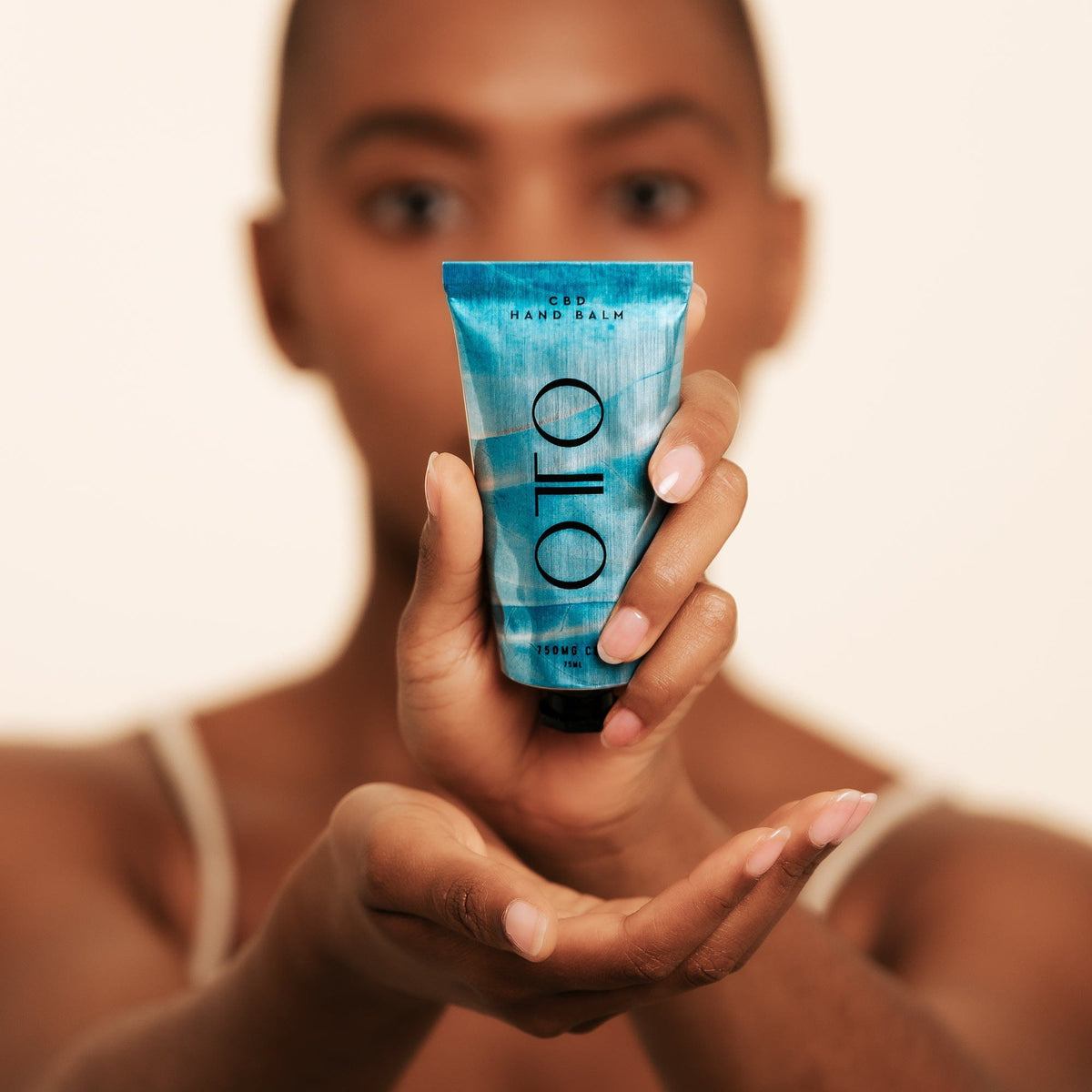 Nourishing CBD Hand Balm - CBD Hand Balm | Deep Moisture in a sleek blue 75ml tube by OTO, designed for hydrating and repairing dry hands with 150mg CBD.