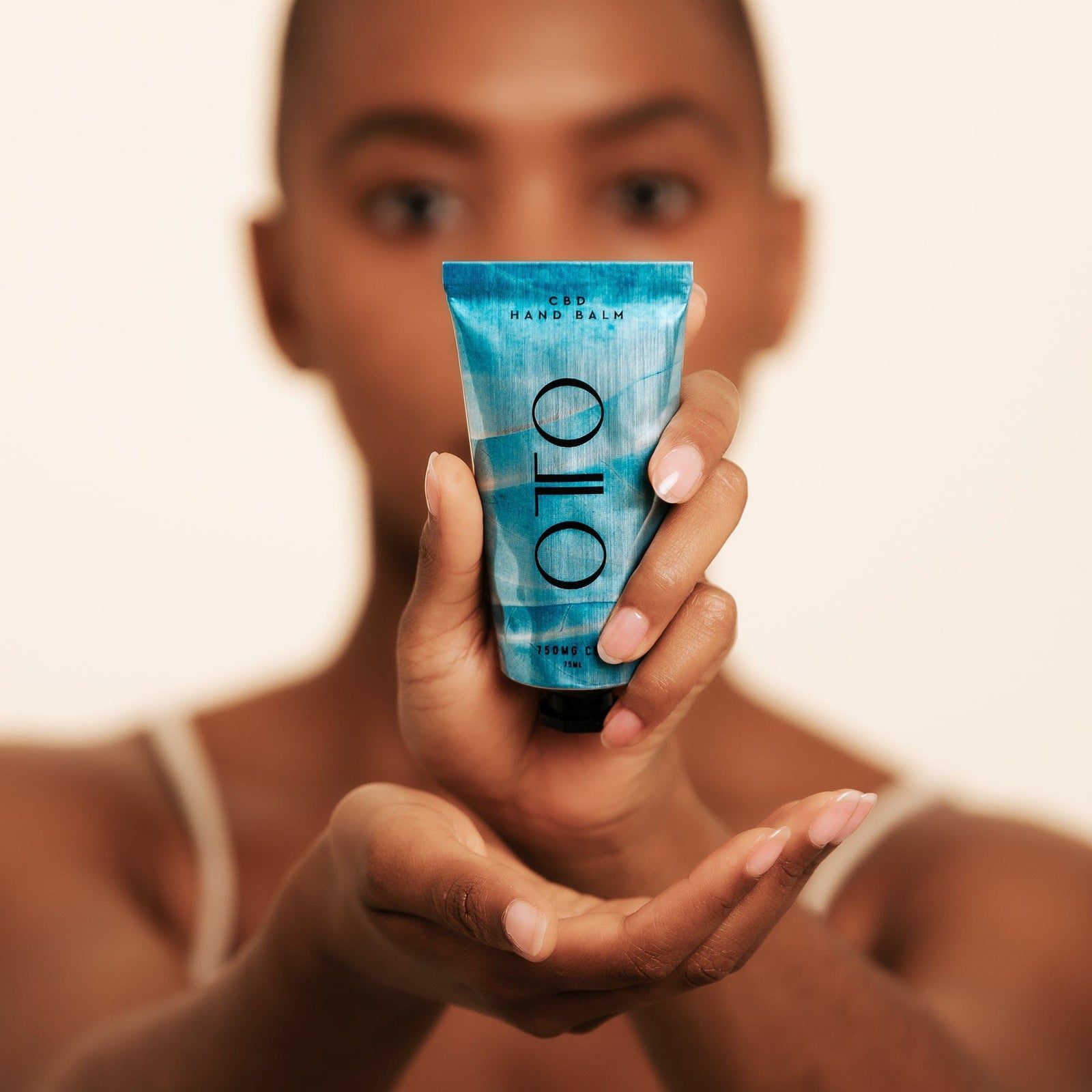 Nourishing CBD Hand Balm - CBD Hand Balm | Deep Moisture in a sleek blue 75ml tube by OTO, designed for hydrating and repairing dry hands with 150mg CBD.