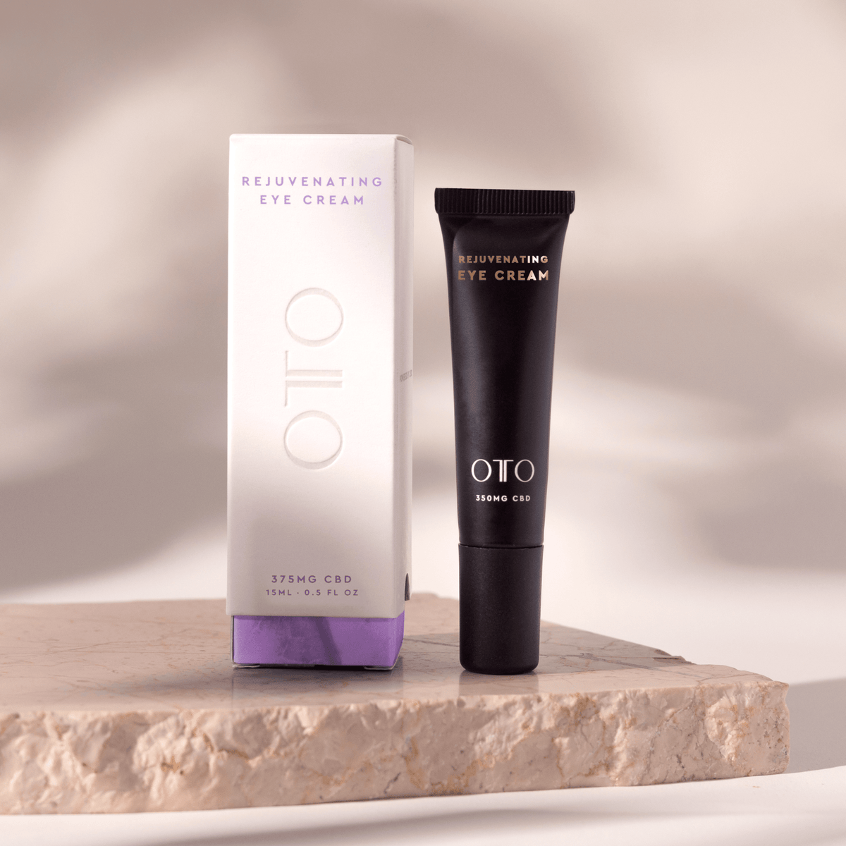 Rejuvenating Eye Cream - CBD Eye Cream for Dark Circles in sleek black tube with gold and white text, 350mg CBD by OTO for anti-aging skincare.