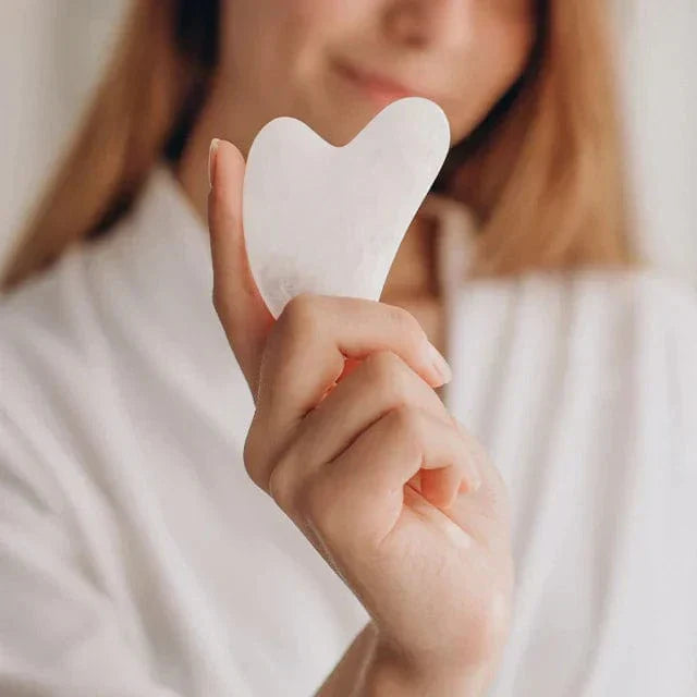 The Gua Sha Tool - Jade Gua Sha Tool | Sculpt & Rejuvenate, a smooth white jade facial massage tool for lifting and toning skin naturally. Ideal for enhancing lymphatic drainage and reducing wrinkles in skincare routines.