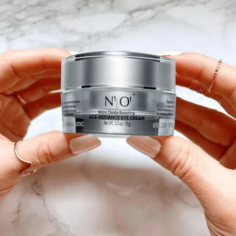 N¹O¹ Age-Defiance Eye Cream in a 15g silver jar, designed to reduce puffiness, wrinkles, and dark circles with nitric oxide boosting formula.