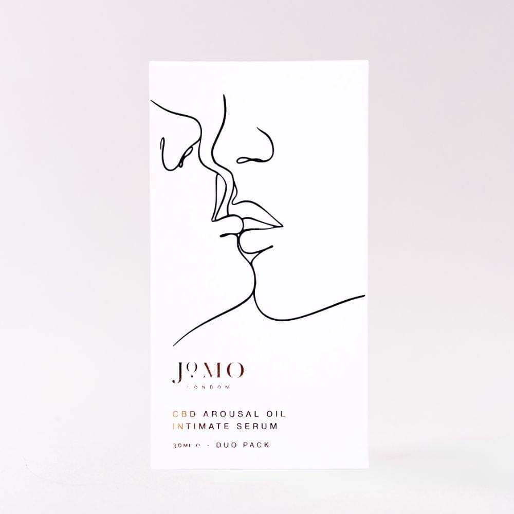 CBD Intimate Bundle - Oil and Serum by Jomo London featuring minimalist line art of kissing faces on white packaging. Enhances pleasure and wellness.