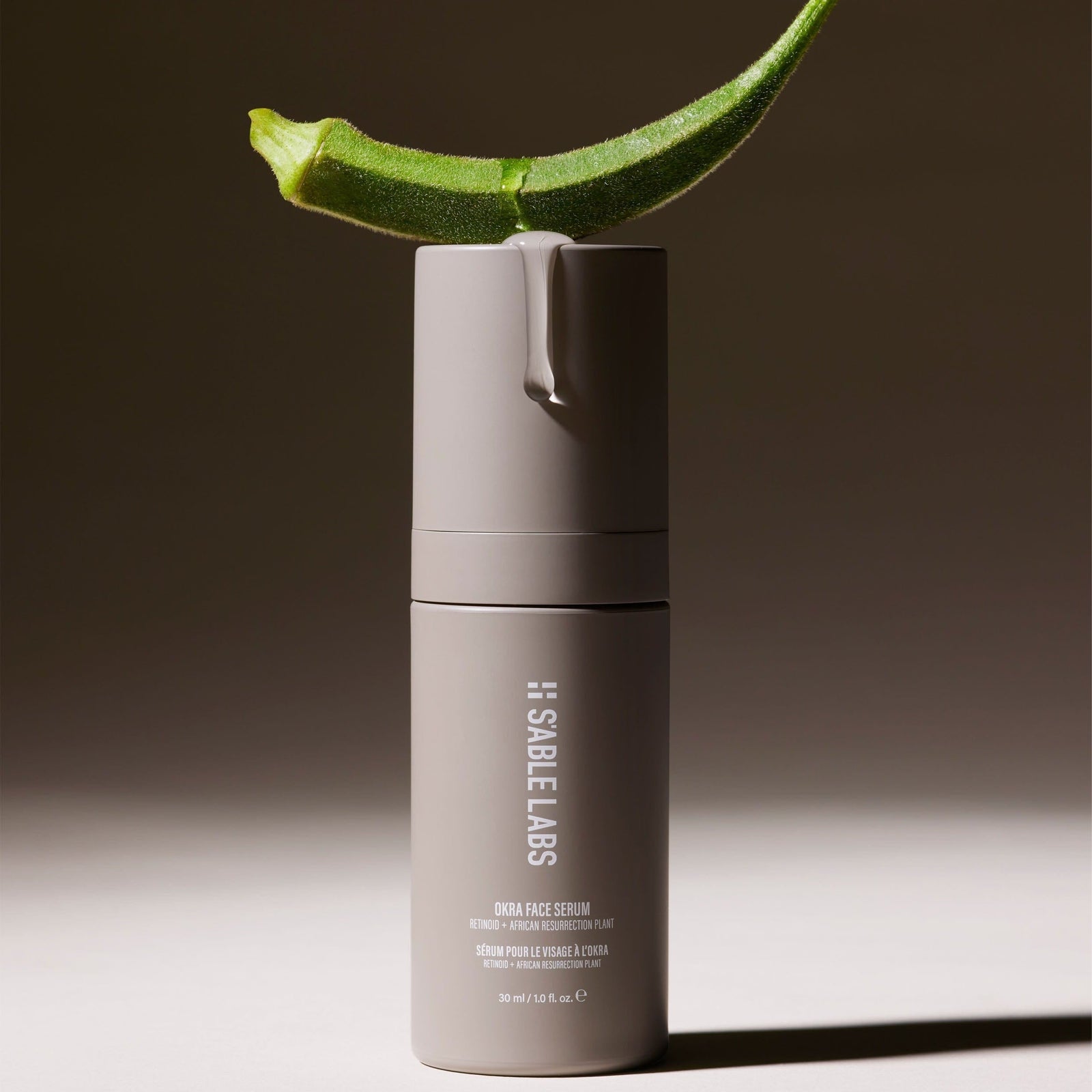 Okra Face Serum by S’Able Labs in sleek grey bottle, a retinoid face serum targeting hyperpigmentation and fine lines for radiant skin.