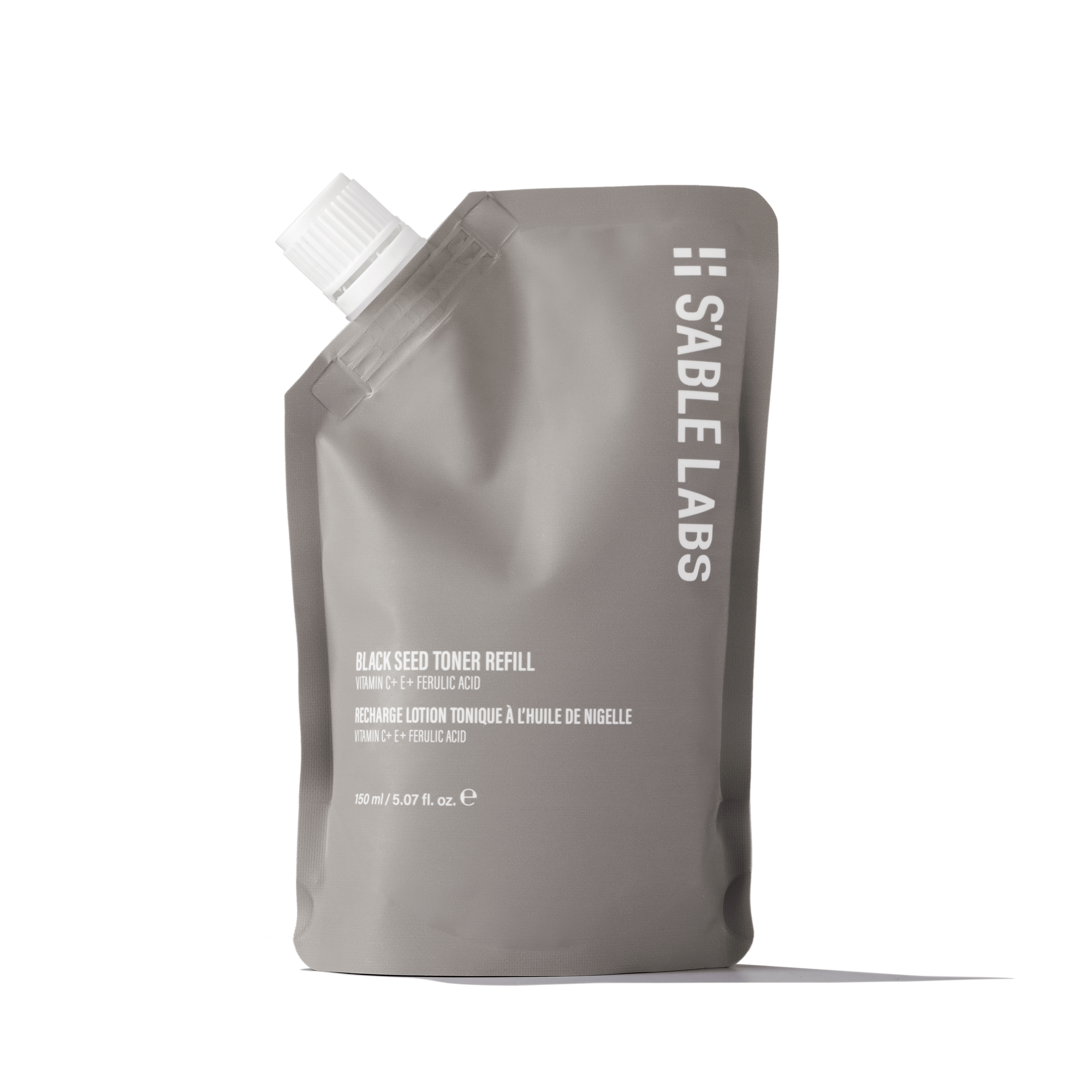 Black Seed Toner Refill - Radiance Restored in eco-friendly pouch by S’Able Labs. Features Vitamin C, E, black seed, and chamomile for glowing skin.