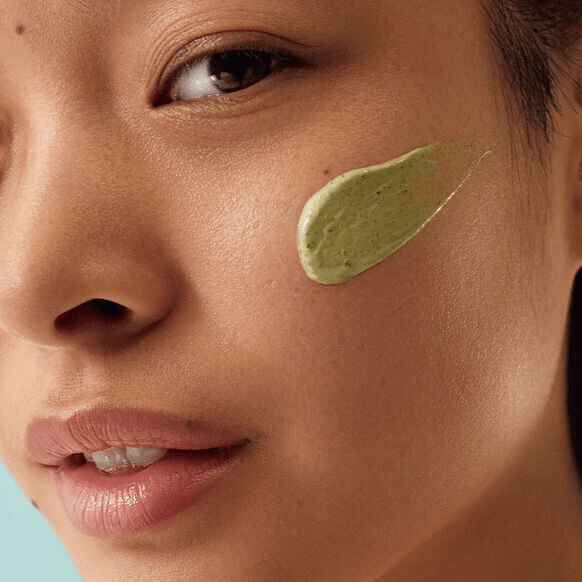 Qasil Exfoliating Mask - Brightening Face Exfoliant | AHAs, PHAs in sleek grey tube held by hand. Natural detoxifying skincare for glowing complexion.