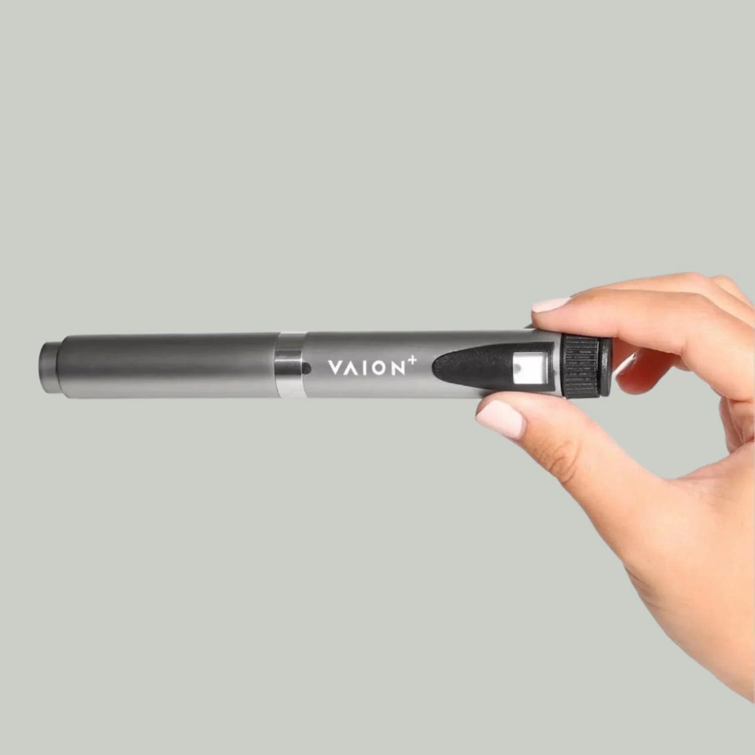 VAION+ NAD Pen - Cellular Wellness Solution | Boosts Energy. Sleek silver wellness pen held by hand, ideal for enhancing energy and focus.